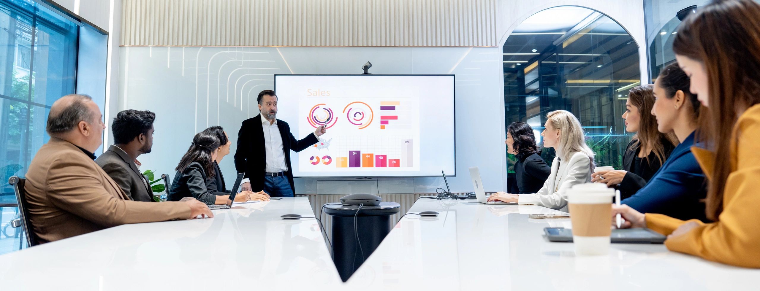 Leadership team reviewing performance in a boardroom meeting