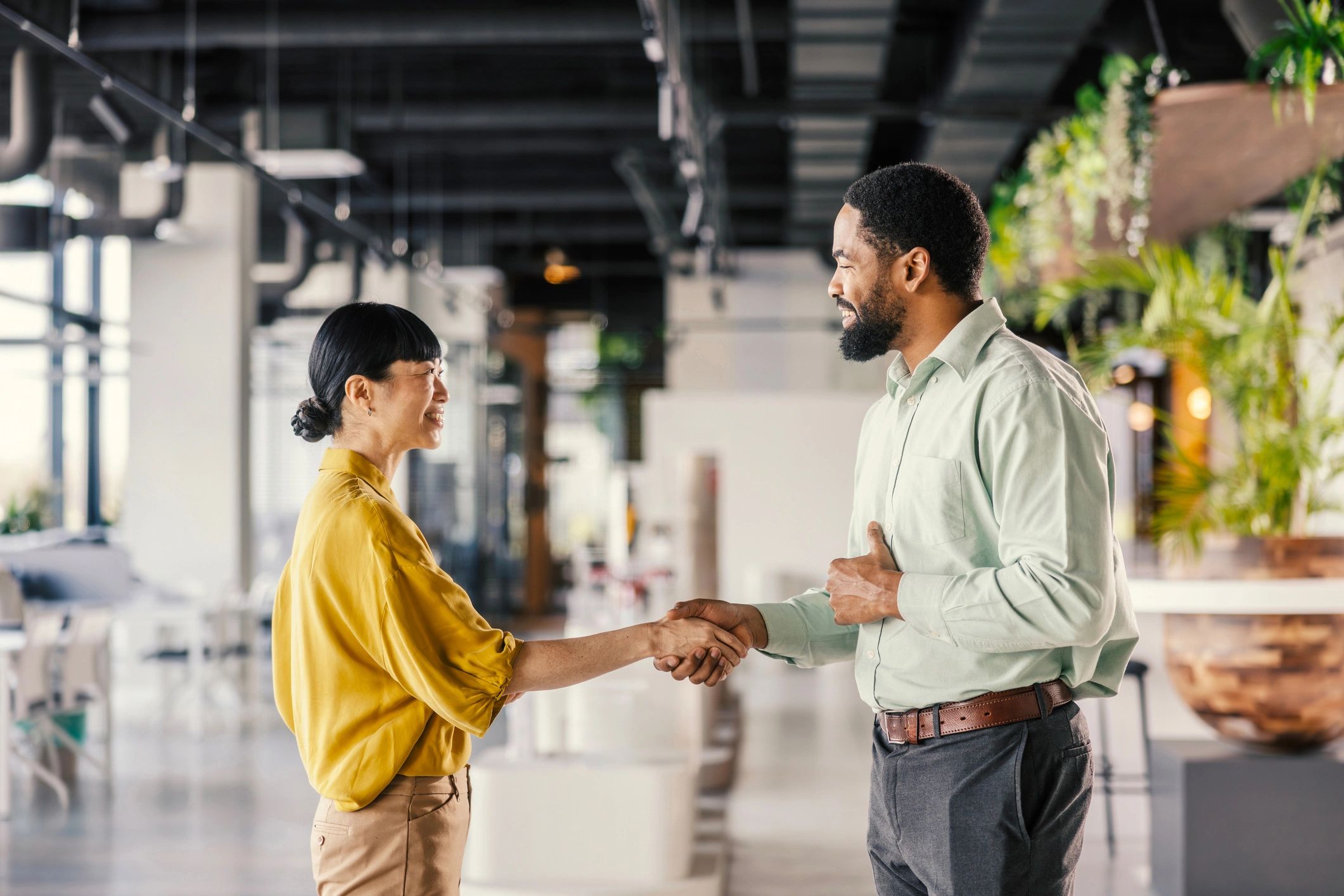 Two business partners shaking hands to mark a long-term partnership
